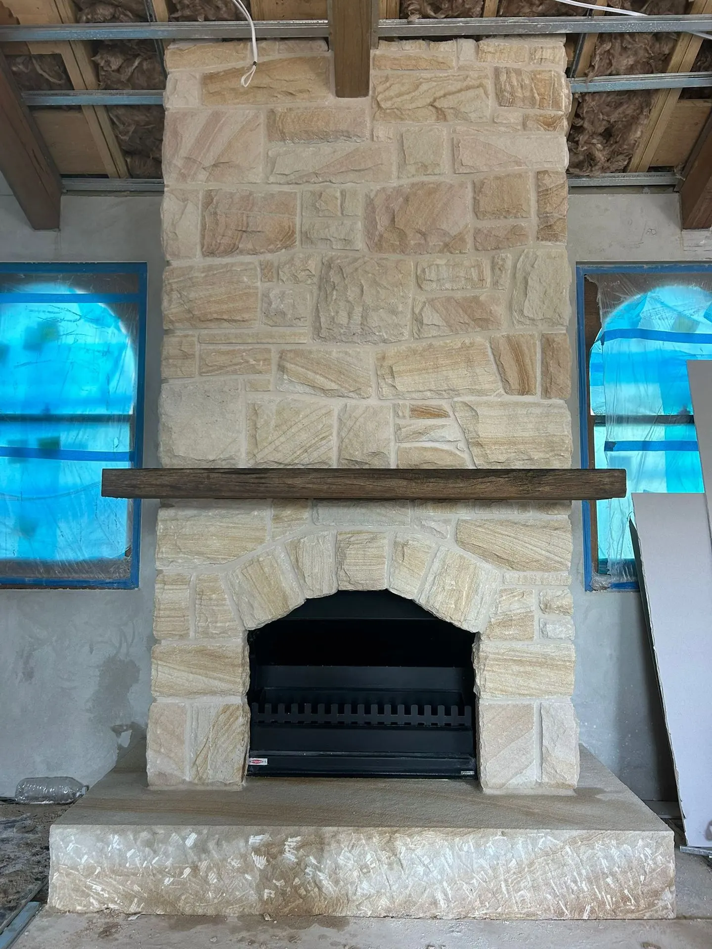 Hand-dressed sandstone fireplace, supplied, installed and grouted