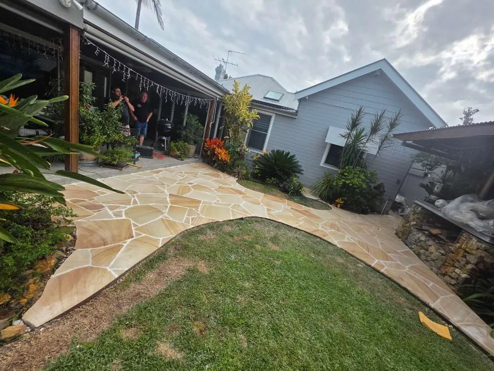 Hand-shaped sandstone crazy paving at a Botany home