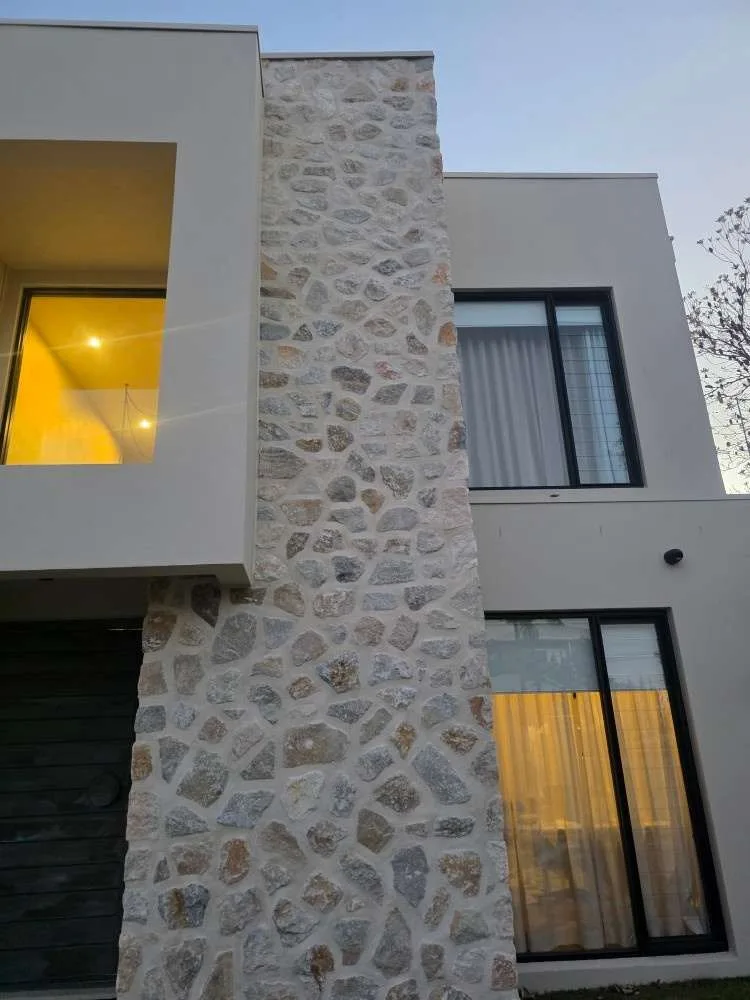 Stone cladding on the Malabar home facade