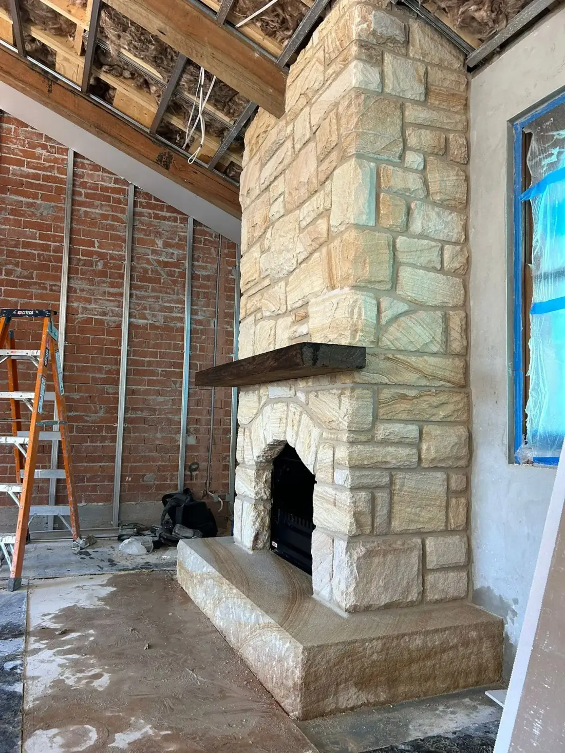 Reused stone hand dressed and matched to the surrounding heritage masonry
